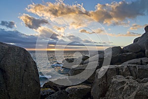 Sunset over rocky beach