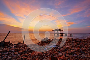 Sunset over rocky coastline