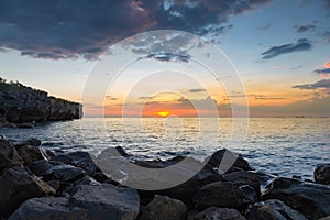 Sunset over rocky seacoast natural landscape