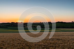 Sunset over the rolling hills in Elkenrade in the of south Limburg in the Netherlands with a spectacular view over the fields