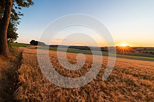 Sunset over the rolling hills in Elkenrade in the of south Limburg in the Netherlands with a spectacular view over the fields