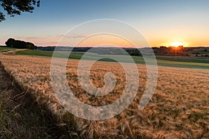 Sunset over the rolling hills in Elkenrade in the of south Limburg in the Netherlands with a spectacular view over the fields