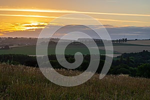 Sunset over the rolling hills in Elkenrade in the of south Limburg in the Netherlands with a spectacular view over the fields