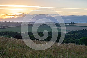 Sunset over the rolling hills in Elkenrade in the of south Limburg in the Netherlands with a spectacular view over the fields