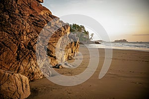 Sunset over the rugged rocks at Tonquin Beach near Tofino, Canada