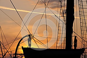 Sunset over sailing boat photo