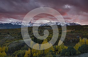 Sunset over San Juan Mountain range and Autumn Fall color of the Dallas Divide Ridgway, Colorado