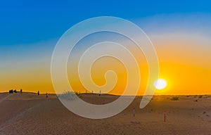 Sunset over sand dunes in Dubai Desert Conservation Reserve