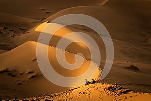 Sunset over the sand dunes in the Sahara desert