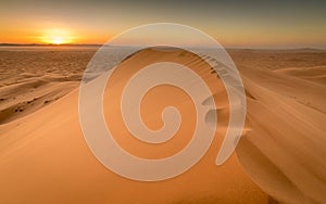Sunset over sand dunes of Sahara, Merzouga, Morocco