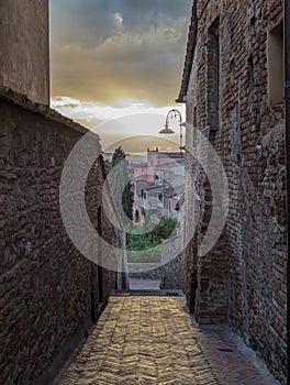 Sunset over the scenic old Tuscan town Certaldo Alto