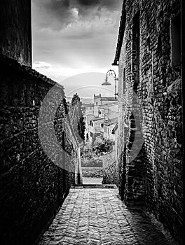 Sunset over the scenic old Tuscan town Certaldo Alto