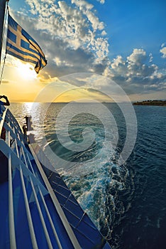 Sunset over sea on ferry in Greece