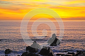 Rocks in Ocean at Sunset, Hartland Quay, Hartland, Bideford, Devon, UK photo