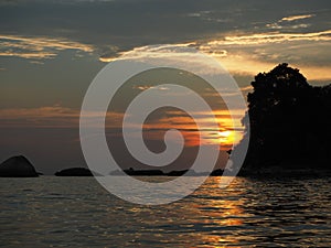 Sunset over the sea with rocks