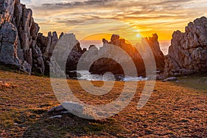 Sunset over a sharp rocky coastline