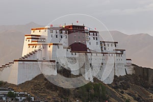 Sunset over Shigatse Dzong Little Potala Palace residence of Panchen Lama, Tibet - China