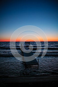 Sunset over a small dock in Sister Bay in Door County, Wisconsin