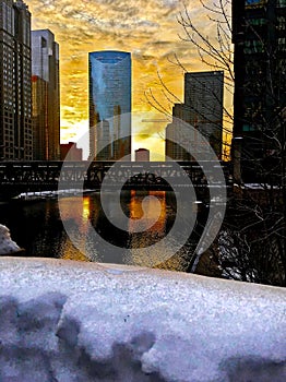 Sunset over a snow-covered Chicagoland and Chicago River in winter.