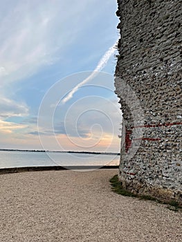 Sunset over the Solent England next to the Roman walls of Portchester Castle