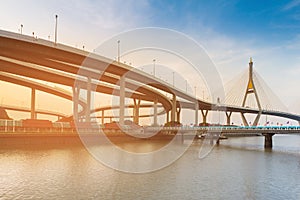 Sunset over Suspension Bridged and Highway interconnection river