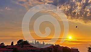 Sunset over Sveti Stefan. Islet and resort in Montenegro. Budva Riviera. Balkans, Adriatic Sea,