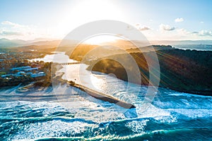 Sunset over Tallebudgera creek and Palm Beach suburb.