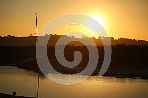 Sunset over the tidal marshes outside Blakeney in Norfolk, England during the autumn