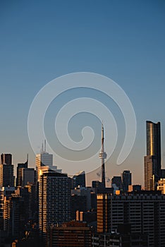 sunset over Toronto city downtown skyline, sunrise over CN Tower and skyscrapers of financial district Canada