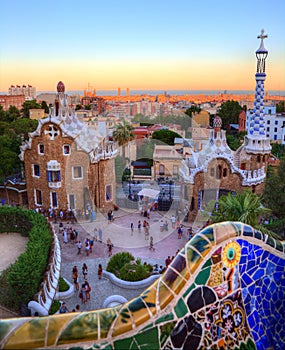 Sunset over tourists visiting Park Guell, Barcelona, Spain