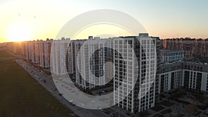 Sunset over typical panel block apartment buildings. Stock footage. Aerial view of beautiful sunset above the sleeping