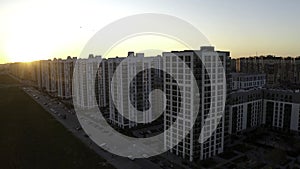 Sunset over typical panel block apartment buildings. Stock footage. Aerial view of beautiful sunset above the sleeping