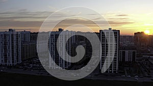 Sunset over typical panel block apartment buildings. Stock footage. Aerial view of beautiful sunset above the sleeping