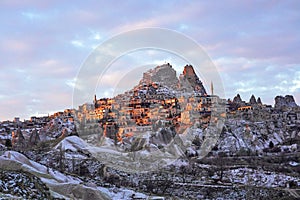 Sunset over the Uchisar Castle in Cappadocia photo