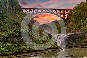 Sunset Over The Upper Falls And Arch Bridge At Letchworth State Park