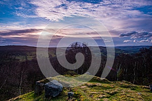Sunset over the valley with dramatic clouds.