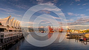 Sunset over the Vancouver Container Port and Harbour between the Canada Place Cruise Terminal and the Waterfront Skytrain