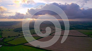 Sunset over Villages, Meadows and Fields from a drone, Berry Pomeroy, Devon, England