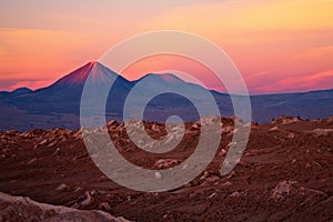 Sunset over volcanoes and Valle de la Luna, Chile