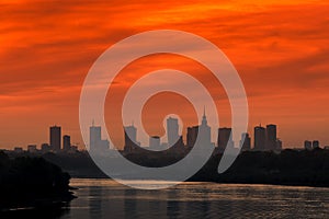 Sunset over the Warsaw city buildings by the Vistula river in Poland.