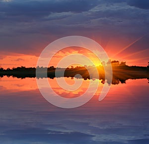 Sunset over water surface