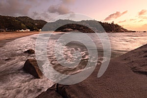 a sunset over waves in bay at Alma Bay on Magnetic Island in Australia