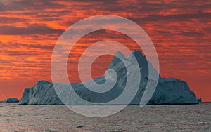 Sunset over weathered iceberg, Antarctica