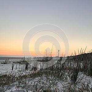 Sunset over white beach