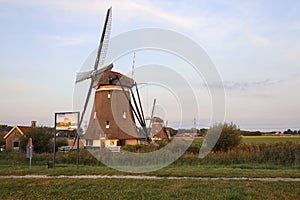 Sunset over the windmills molenviergang of the Tweemanspolder in Zevenhuizen