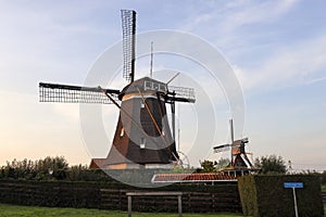 Sunset over the windmills molenviergang of the Tweemanspolder in Zevenhuizen