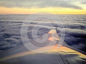 Sunset Over the Wing: A View from Inside the Airplane