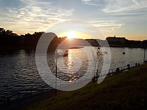 Sunset over the Wisla river in Krakow photo