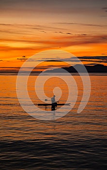 Sunset over wooden beach bar in sea and hut on pier in koh Mak island, Trat, Thailand