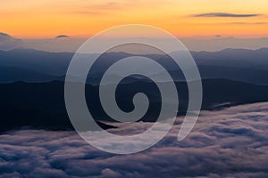 Sunset overlooking mountains with Mist